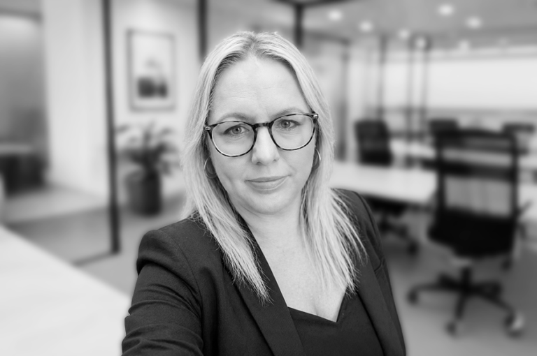 a women looking professional in an office headshot