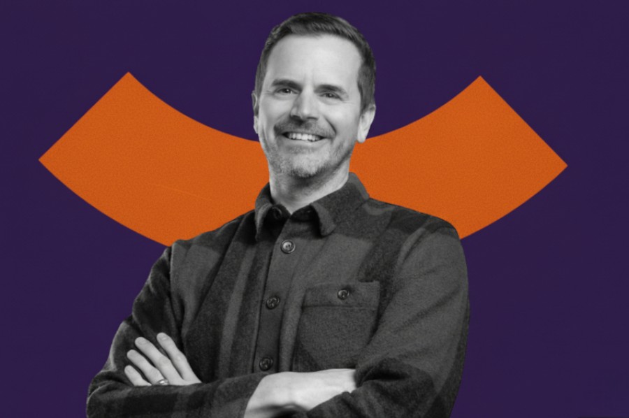 Stylised portrait of a person with arms crossed against a graphic background, representing confidence and brand identity.